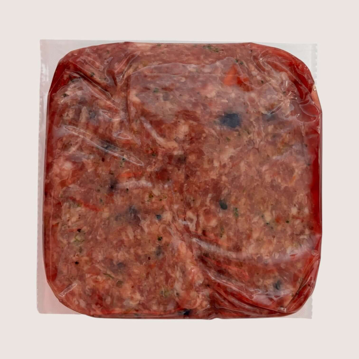 Pork raw dog food in vacuum-sealed packaging, Pure Blend Pork from Carnevore Mountain.