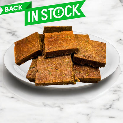 Beef liver and super greens dog treats, back in stock, healthy dog snack on a white plate.