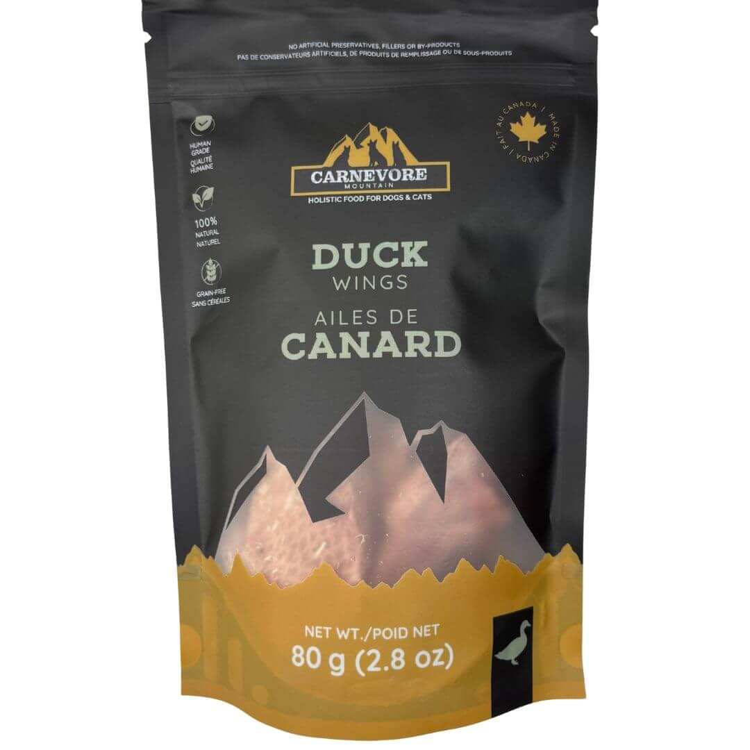 Freeze dried duck wings dog treats in a resealable bag, featuring a mountain design and nutritional information.