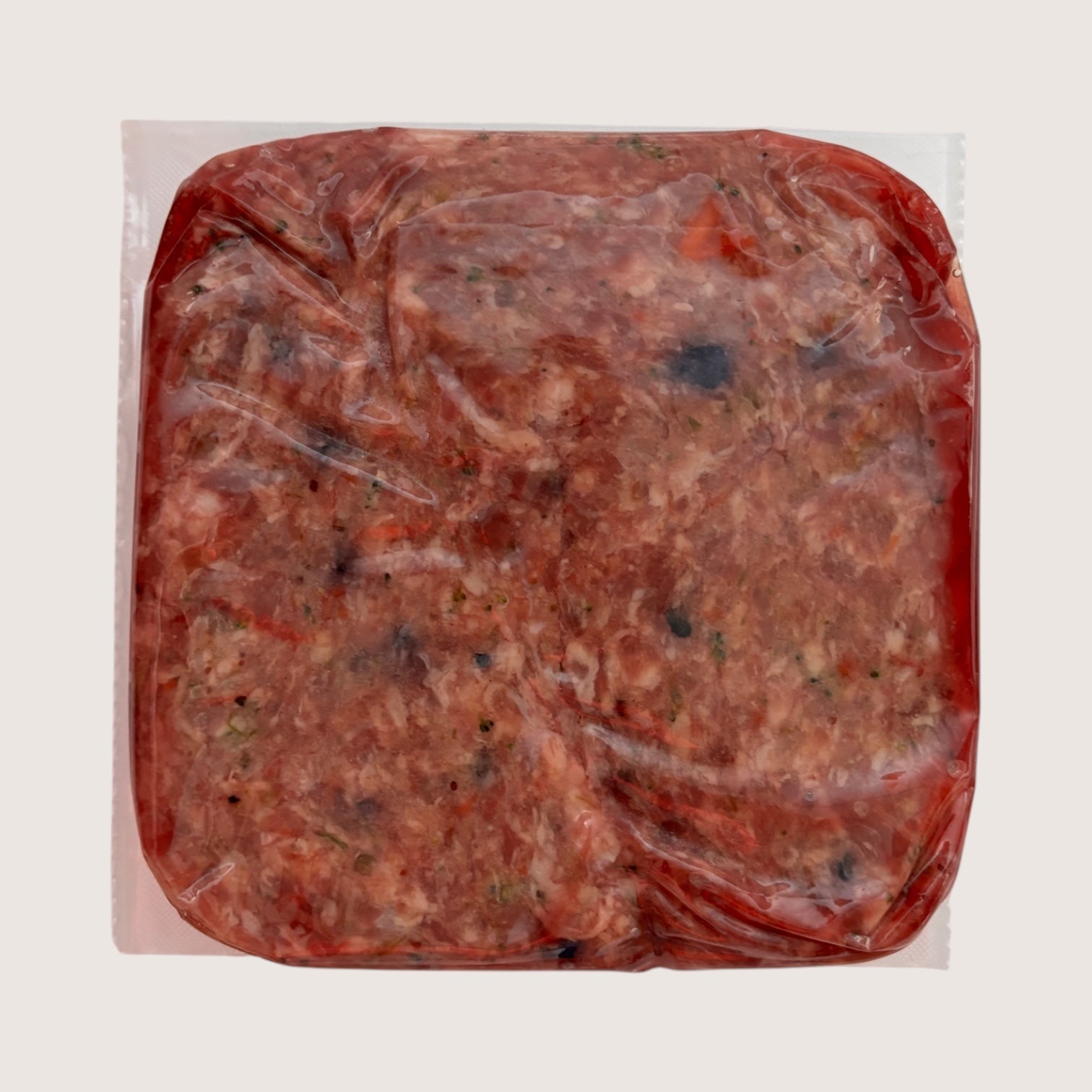 Pork raw dog food in vacuum-sealed packaging, Pure Blend Pork from Carnevore Mountain.