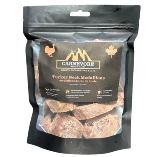 Image of Carnevore Mountain freeze dried turkey neck medallions in black standup pouch. 