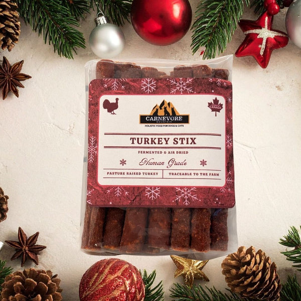 Packaged turkey stix with Carnevere label on a festive background with Christmas decorations.